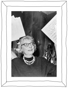 A black and white photo of Jane Jacobs in a hand-drawn picture frame.